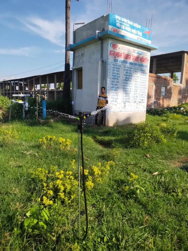 A rural woman operates an industrial fiber-spinning machine, an example of BJUP's Women micro-enterprise support for sustainable income generation in Bihar.