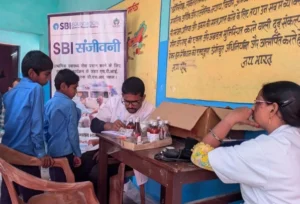 A doctor examining rural children at an SBI Sanjeevani mobile medical health camp organized by leading Health and WASH NGO in Bihar BJUP