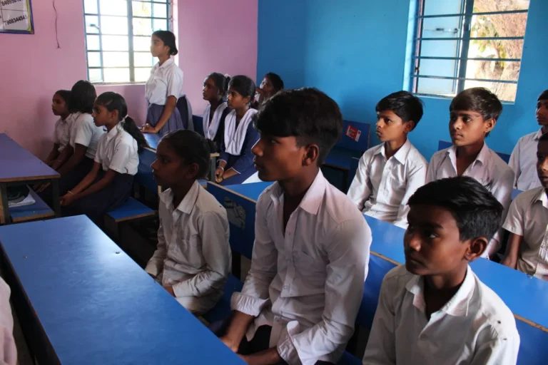 Students and a teacher inside a community library safe space managed by Child Protection NGO in Bihar BJUP and RMI in the Mica Belt region